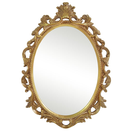 An oval mirror with a scroll design in an antique gold finish, reflecting a well-lit interior room.
