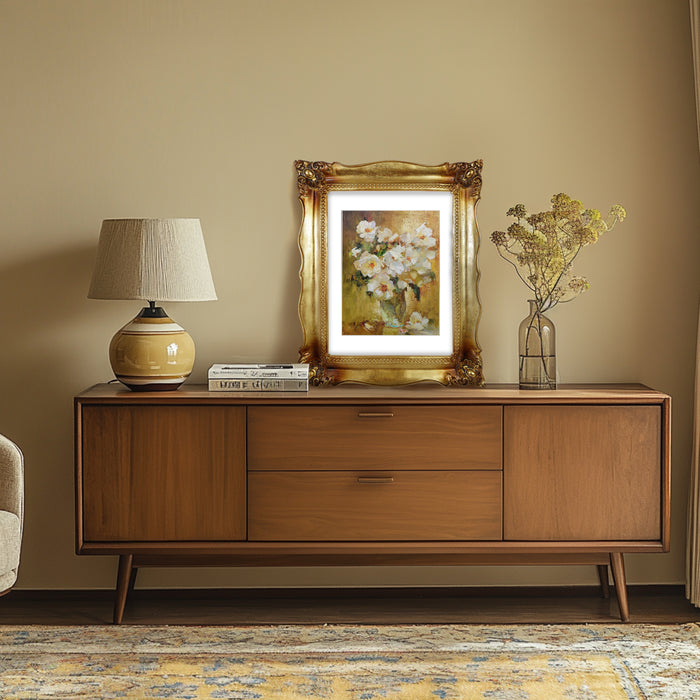 An antique gold picture frame with a white mat, displayed with a picture of floral.
