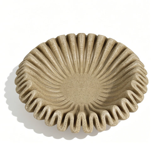 A round, shallow decorative bowl with a textured, ribbed fluted rim, shown from a top-down perspective on a white background.