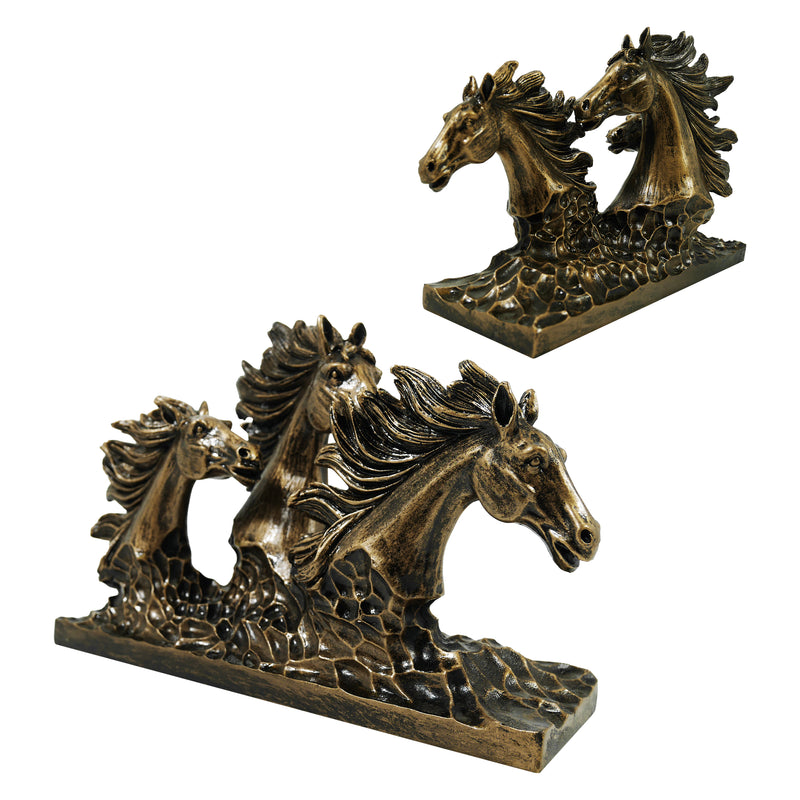 A bronze sculpture of three horses in mid-gallop with flowing manes, positioned on a flat base.