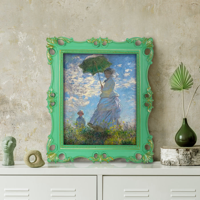 An ornate vintage-inspired picture frame with green edges and gold accents, designed for an 8x10-inch picture, featuring a decorative painting of a woman inside.