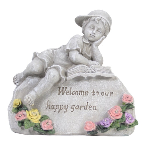 Statue of a child reading a book with flowers and 'Welcome to our happy garden' text on a white background