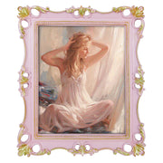 An ornate vintage-inspired picture frame with pink edges and gold accents, designed for an 8x10-inch picture, featuring a decorative painting of a woman inside.