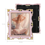 An ornate vintage-inspired picture frame with pink edges and gold accents, designed for an 8x10-inch picture, featuring a decorative painting of a woman inside.