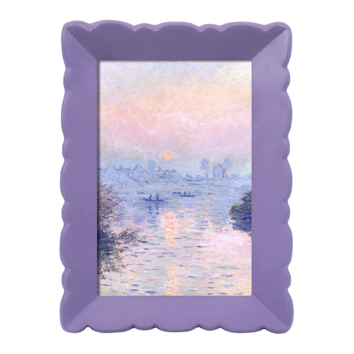 Purple scalloped frame with a painting of a sunset over water.