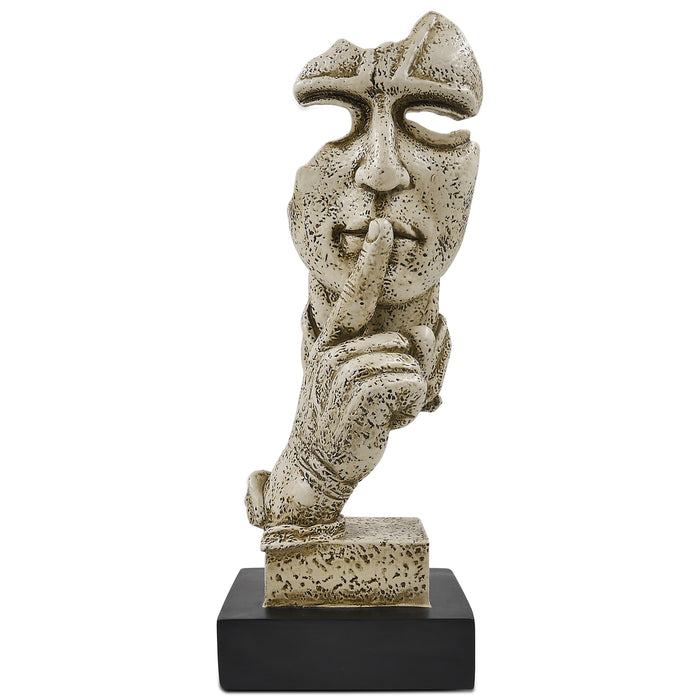 A sculpture of a human figure with an index finger to their lips, indicating silence or quiet. The figure appears to be made of a textured, possibly stone or concrete-like material, and is placed on a dark base.
