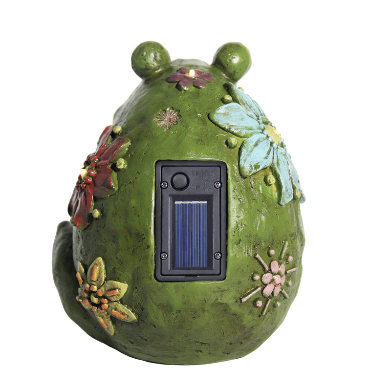 Decorative solar light shaped like a green frog with floral designs on a white background