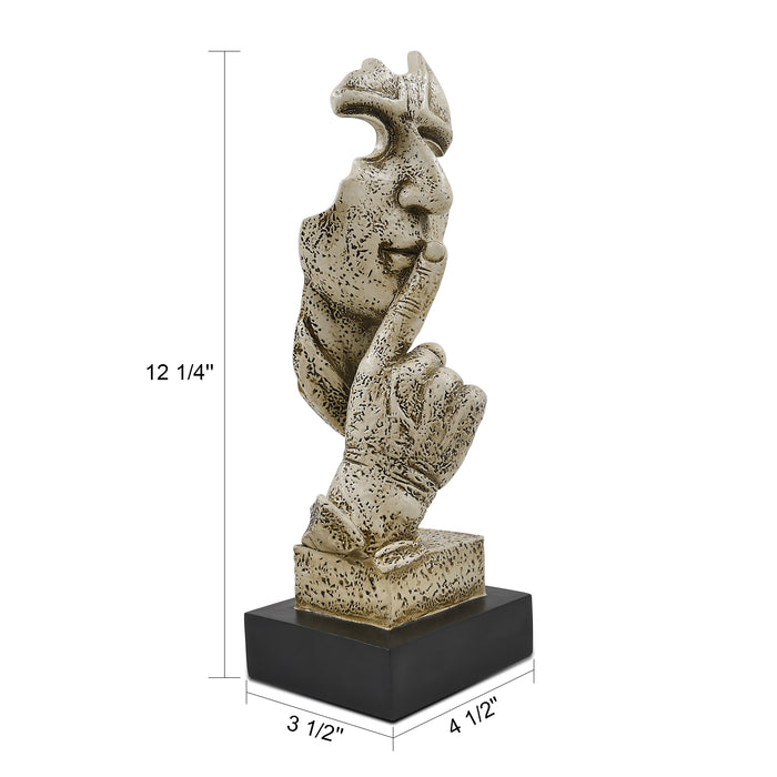 A sculpture of a human figure with an index finger to their lips, indicating silence or quiet. The figure appears to be made of a textured, possibly stone or concrete-like material, and is placed on a dark base.