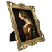 An ornate vintage-inspired gold picture frame, designed for an 8x10-inch picture, featuring a decorative painting of a woman inside.