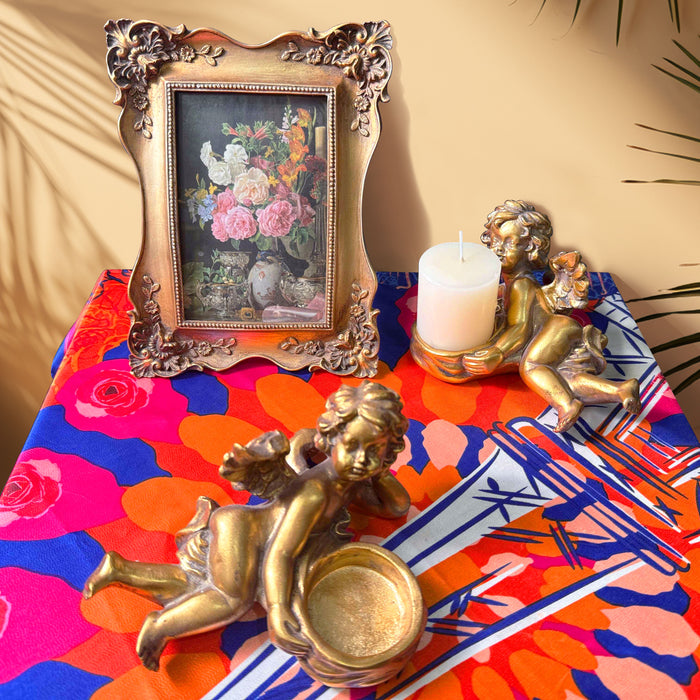 Gold cherub tealight candle holders, perfect for creating a balanced and harmonious display.