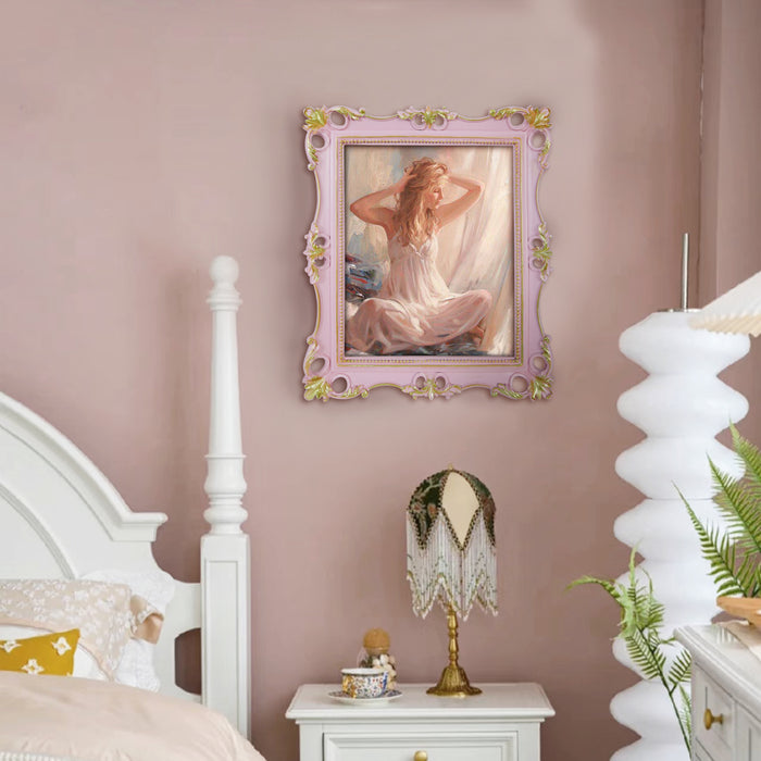 An ornate vintage-inspired picture frame with pink edges and gold accents, designed for an 8x10-inch picture, featuring a decorative painting of a woman inside.