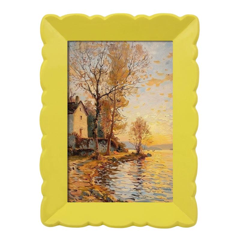 Framed painting of a landscape with trees and water, yellow frame.