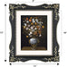 Decorative black picture frame with floral design, containing a painting of flowers in a vase.