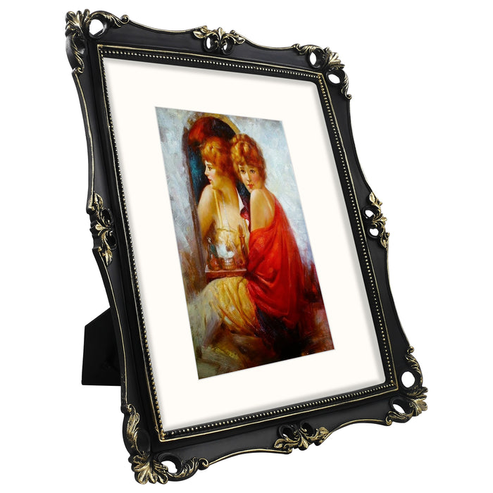 An 11x14-inch picture frame with a mat for an 8x10-inch photo, featuring sculpted edges and decorative accents in a hand-painted antique style finish.