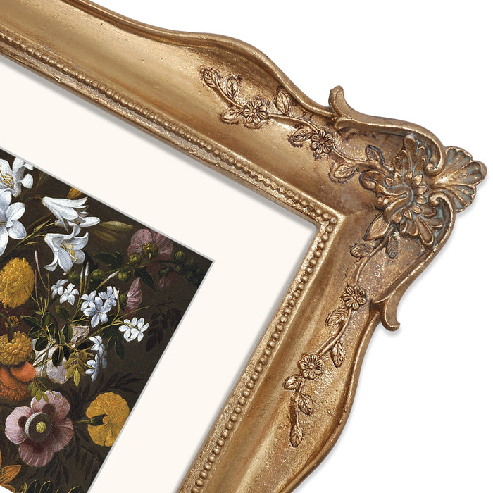 Decorative gold frame with floral design on a white background.
