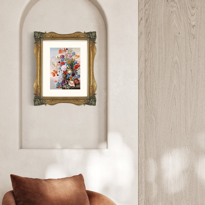 Gold picture frames featuring vintage-inspired floral carvings at each corner.