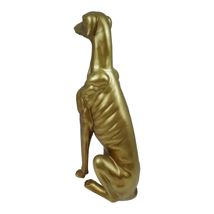 Gold greyhound dog statue on a white background.