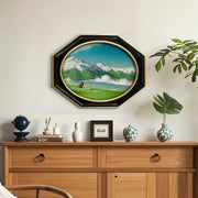 Octagon-shaped picture frame with oval opening in black and gold finish.