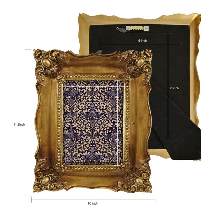 Decorative gold frame with intricate designs and measurements on a white background.
