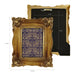 Decorative gold frame with intricate designs and measurements on a white background.