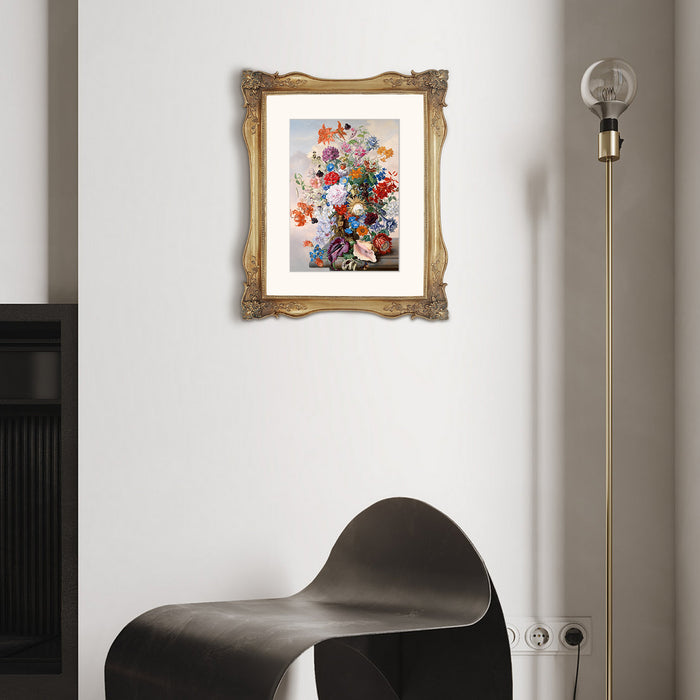 Framed floral painting on a wall with a modern black chair and floor lamp.