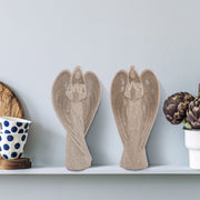 Pair of beige sandstone-look figurines