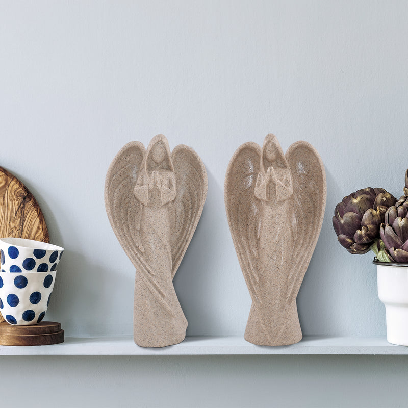 Pair of beige sandstone-look figurines