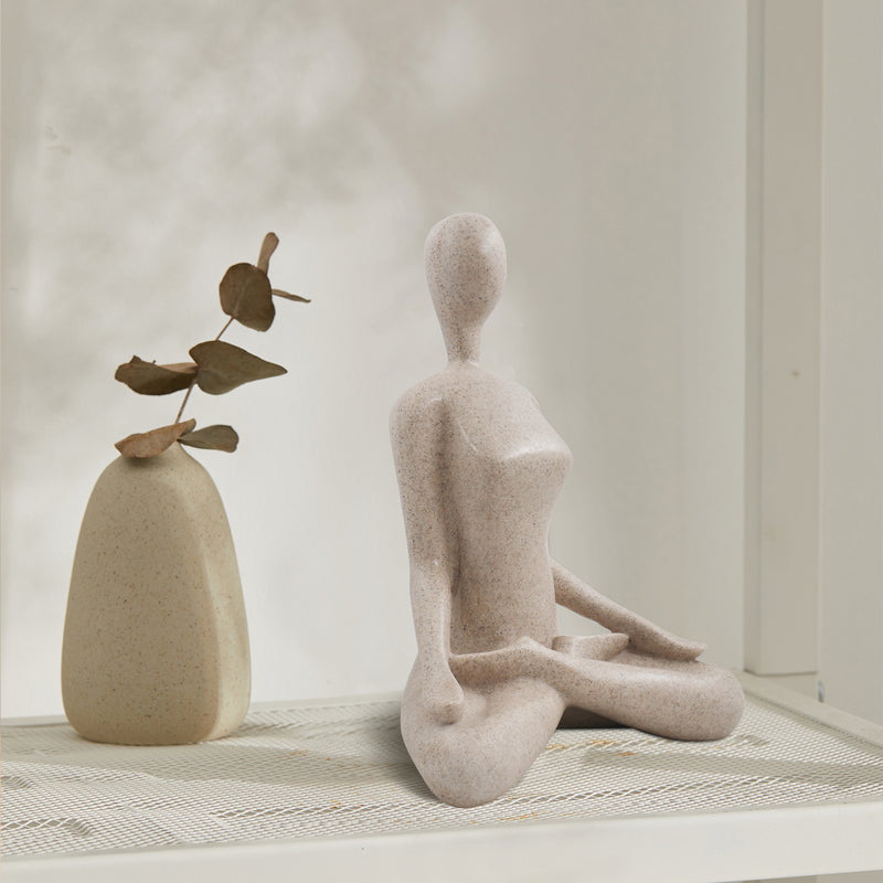 This yoga sculpture has a neat stone-looking with beige color and smooth texture. It can fit any home office decor style. 
