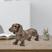Dachshund statues are beautifully crafted in resin with charming details of paper-cutting style carving.