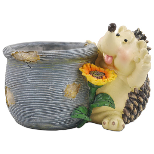 A resin hedgehog planter in gray and beige colors, featuring a flower and resting its head on a pot.