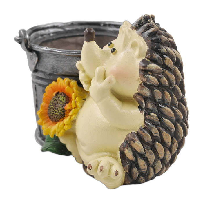 A beige and gray resin hedgehog planter with a sunflower decoration, designed for home garden decor.