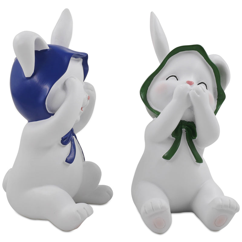 Two resin figurines of sitting rabbits with hats, one with eyes covered and one with a mouth covered, in different poses.