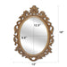 A vintage oval wall mirror with a decorative gold frame, designed for mounting on a wall.