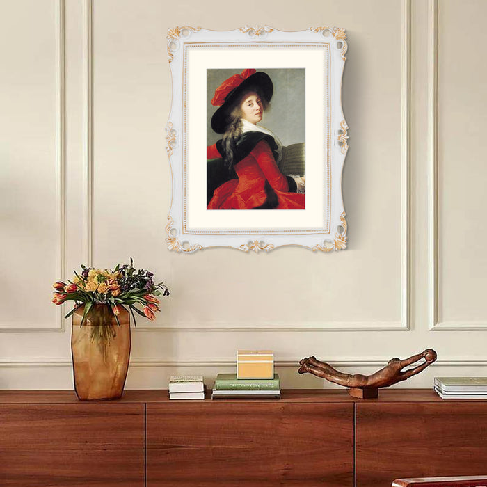 An 11x14-inch picture frame with a mat for an 8x10-inch photo, featuring sculpted edges and decorative accents in a hand-painted antique style finish.